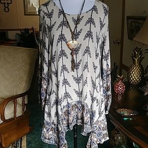 Super cute tunic top with scarf hem.